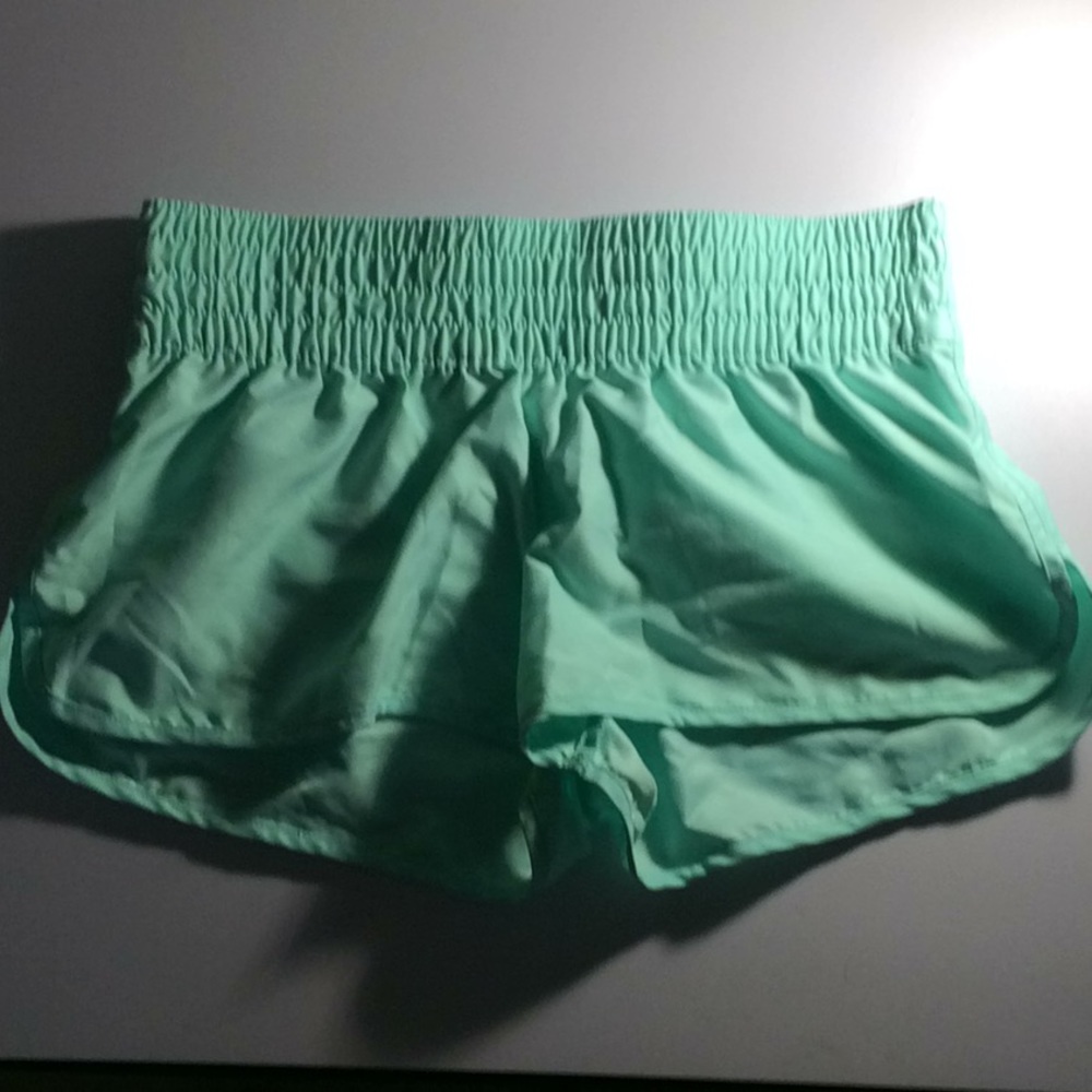 Light green swim shorts